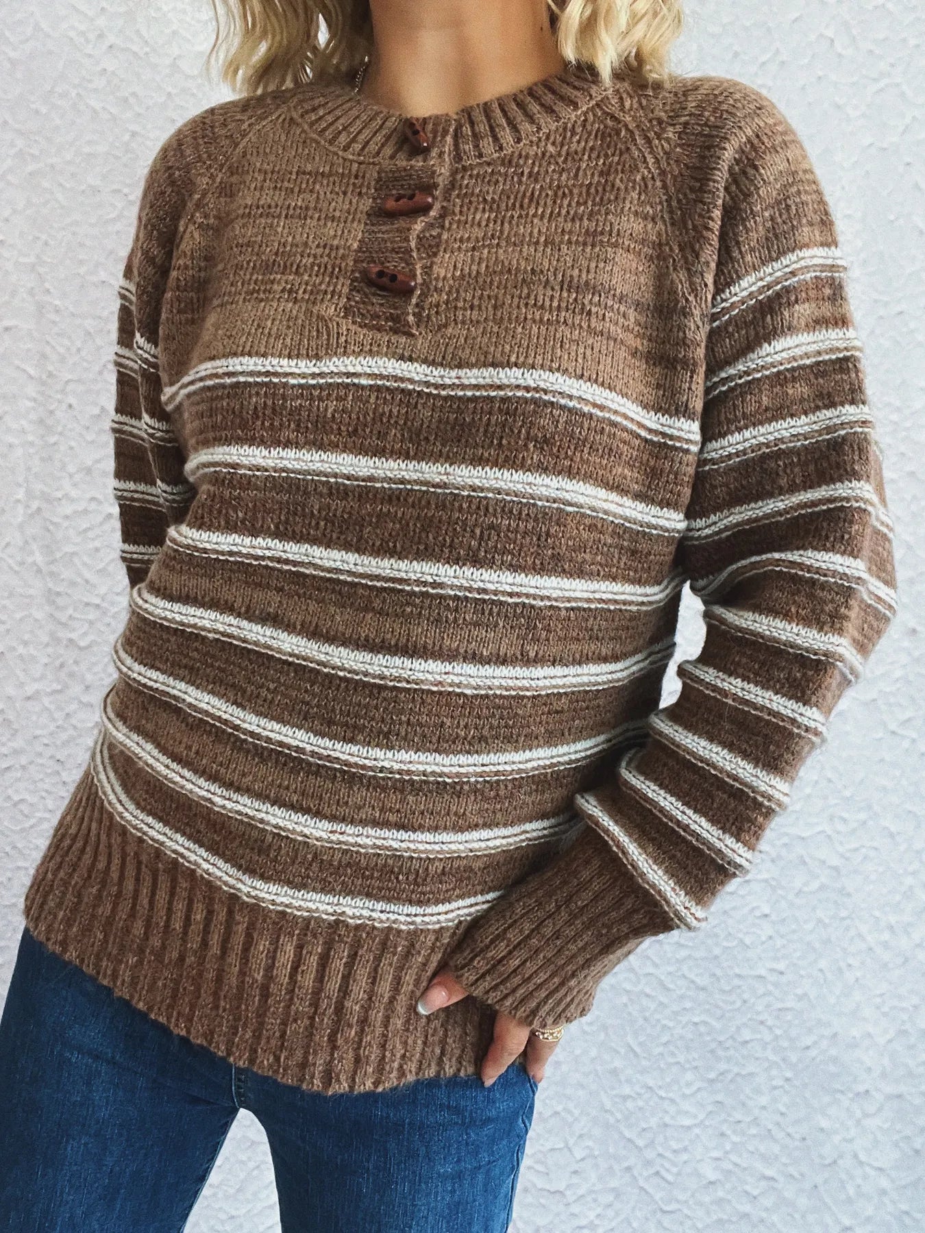 Brown striped knit sweater with button-front placket and white stripe bands