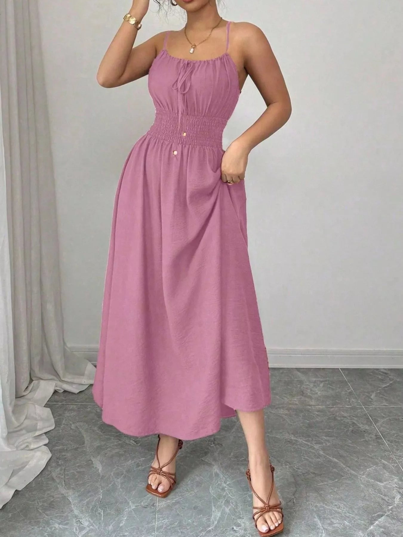 Smocked spaghetti strap midi dress in pink with gathered bodice and small front buttons