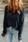 Long raglan sleeve round neck top in dark navy with contrast trim at seams and cuffs.