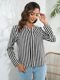 Black-and-white striped long-sleeve notched blouse with button front