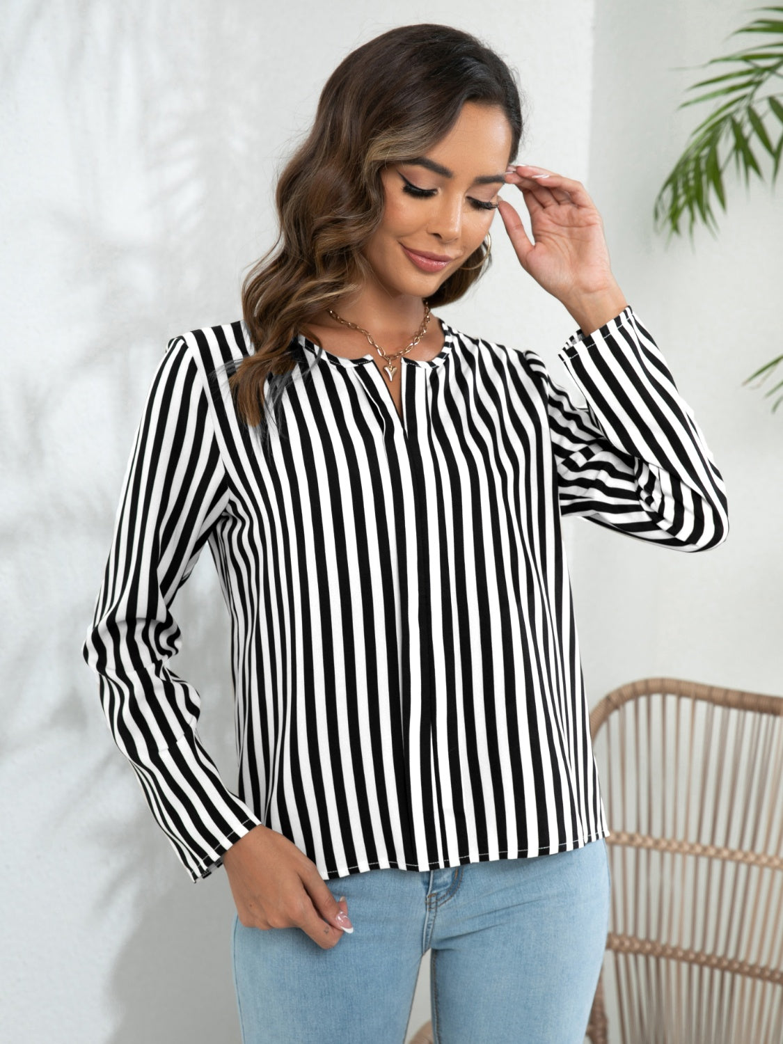 Black-and-white striped long-sleeve notched blouse with button front