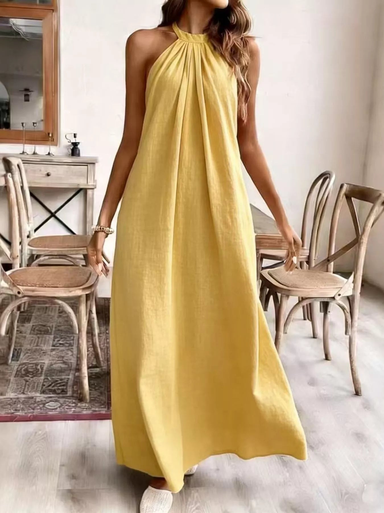 Light green halter neck maxi dress with gathered high neckline and sleeveless style