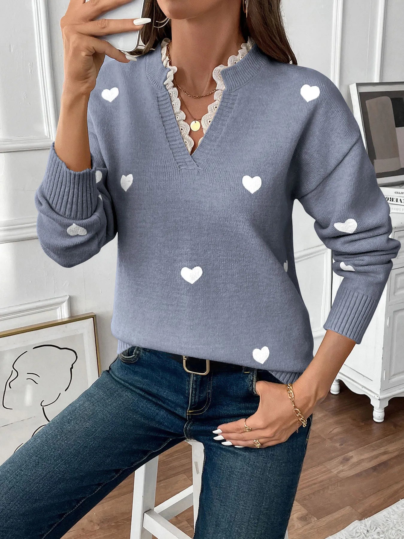 Blue v-neck long sleeve sweater with white heart print, ribbed hem and cuffs