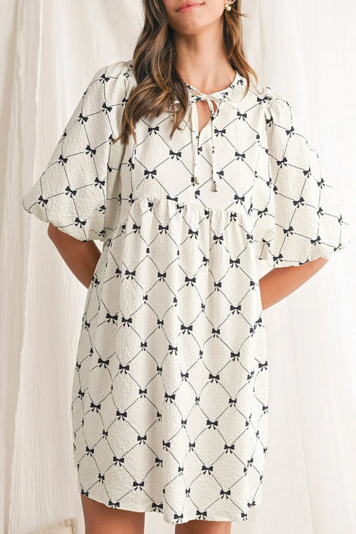 White bow print tie-neck half sleeve dress, gathered chest and skirt