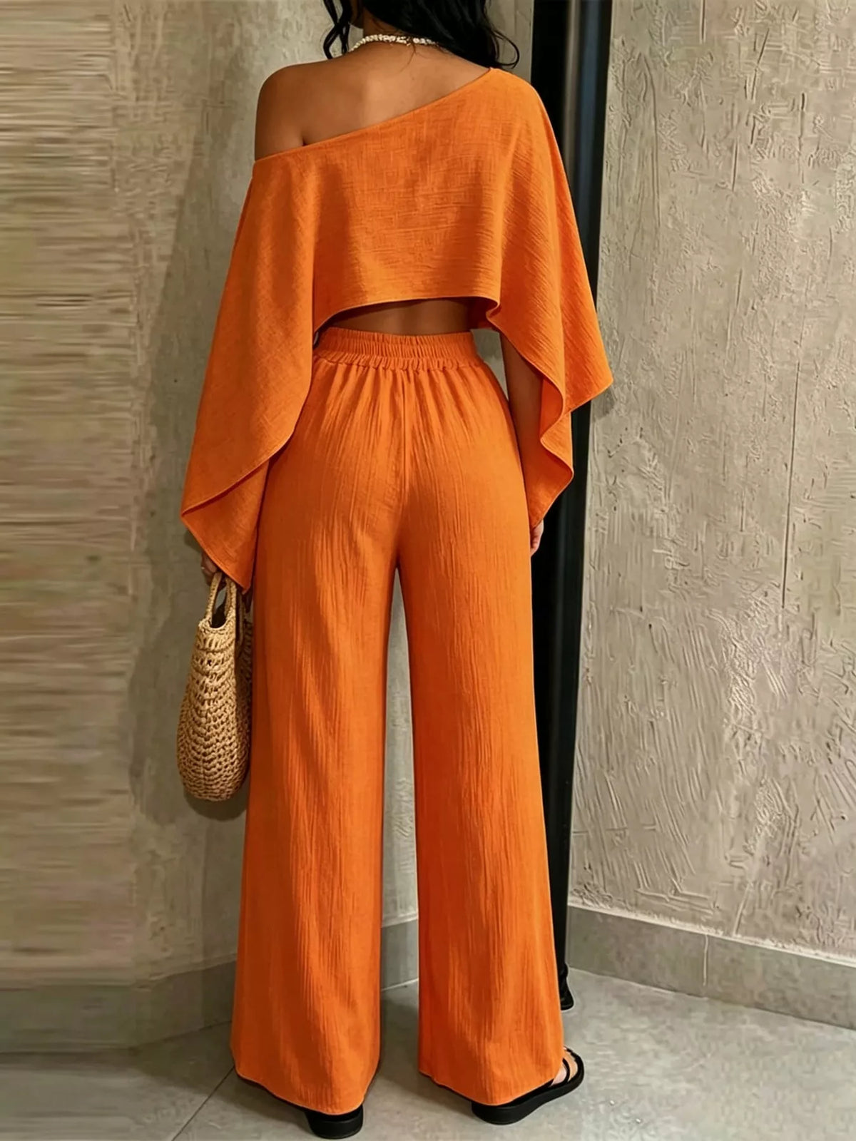 Orange boat-neck crop top with wide-leg pull-on pants, back view.