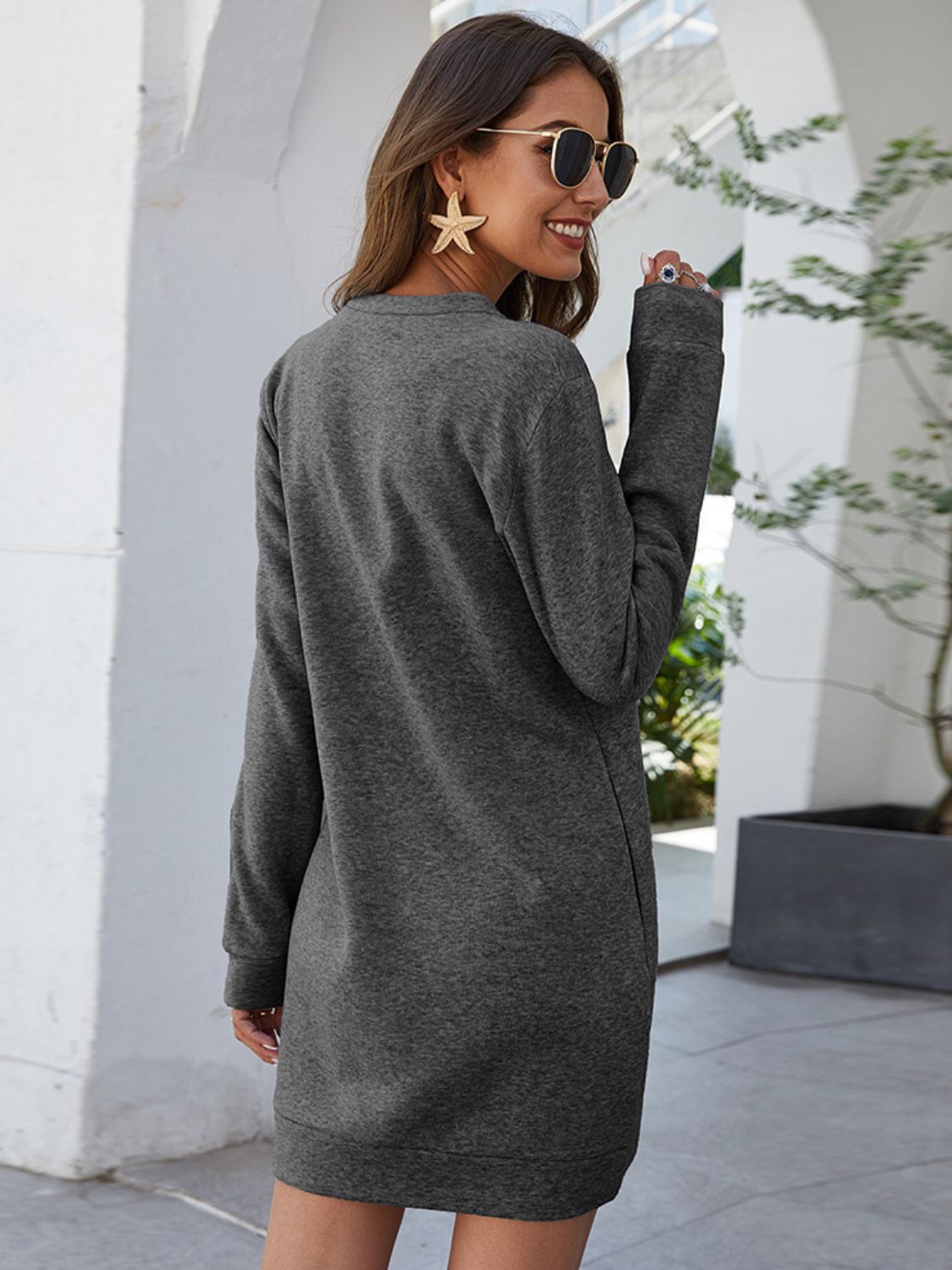 Heather gray round-neck long-sleeve mini dress shown from the back, straight hem.