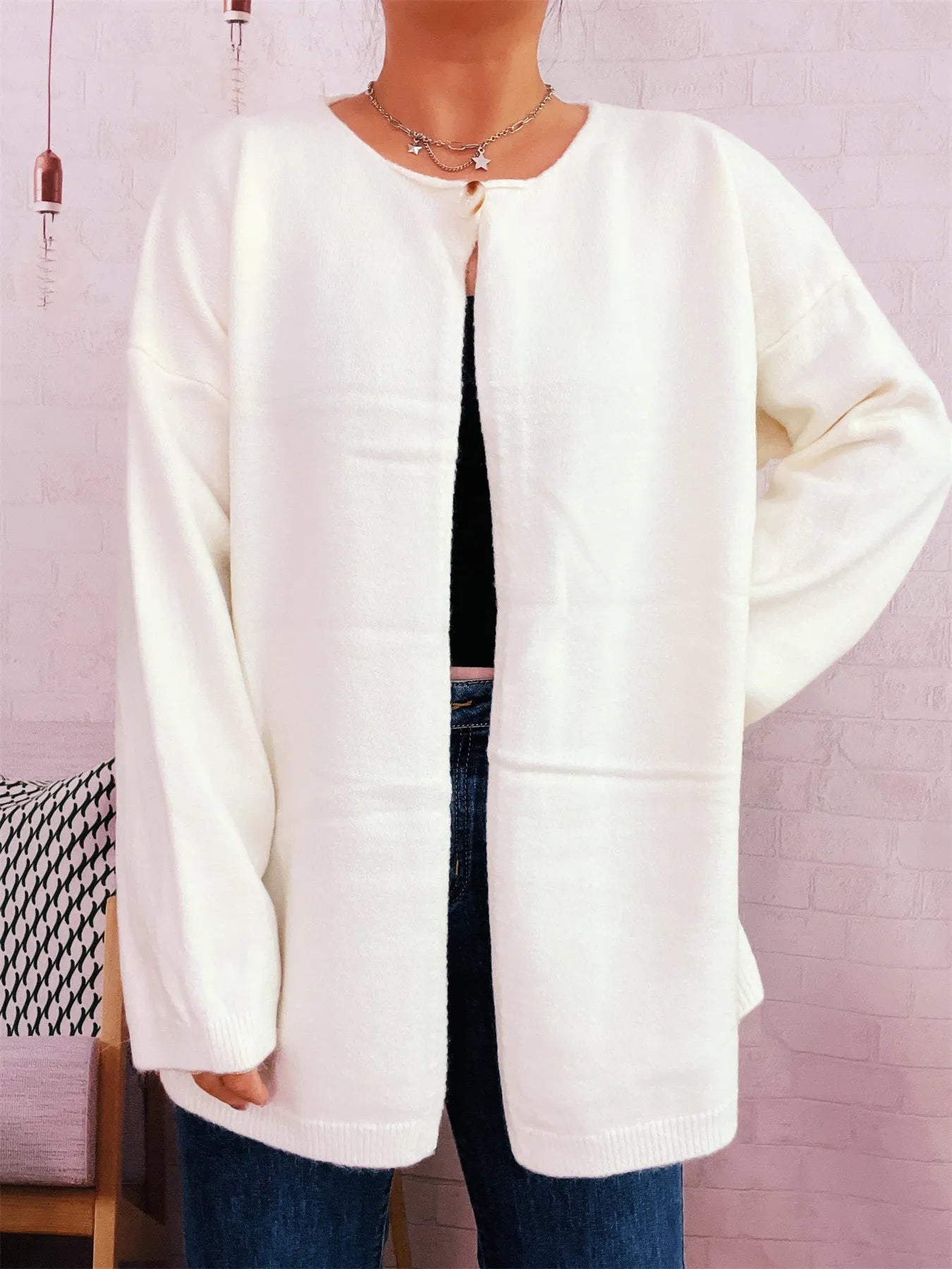Ivory one-button drop-shoulder cardigan with single front button and long sleeves