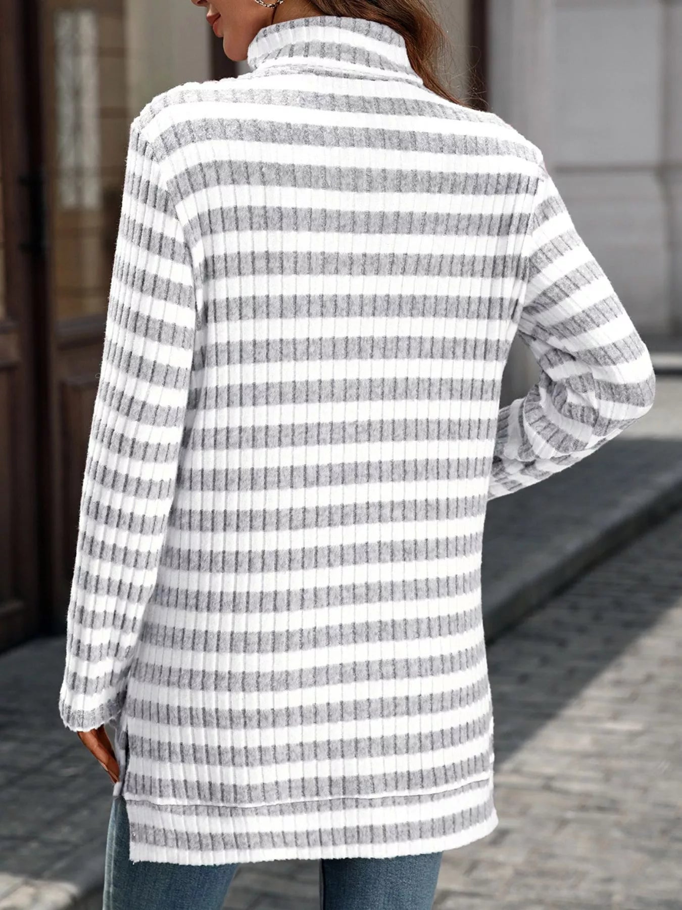 Striped turtleneck long sleeve knit top in white and gray, back view