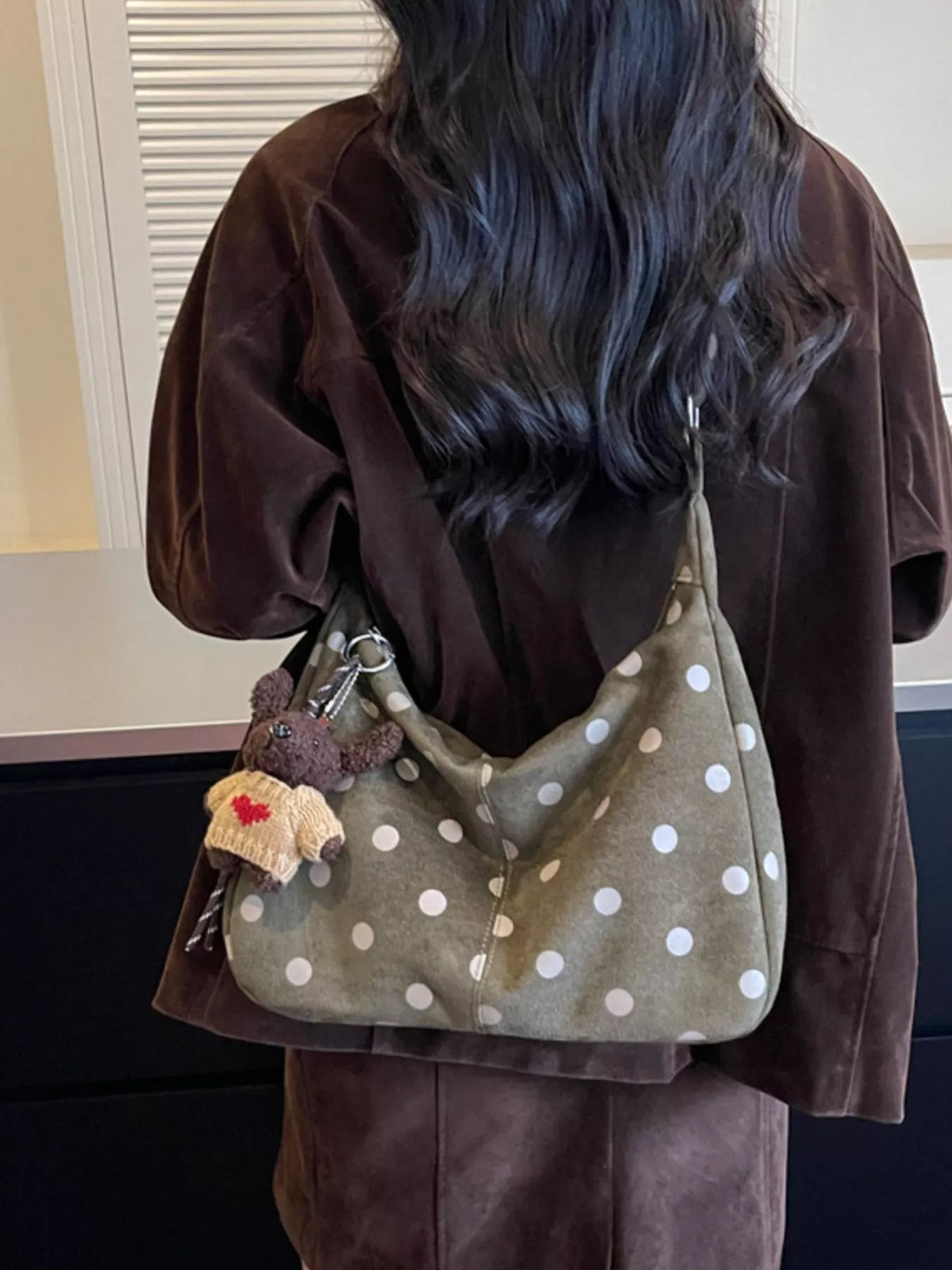 Green suede polka-dot shoulder bag with teddy charm and adjustable strap, rear view