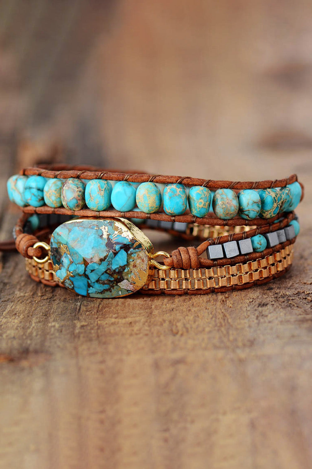 Turquoise cabochon copper bracelet with stacked beaded rows and small white square accents