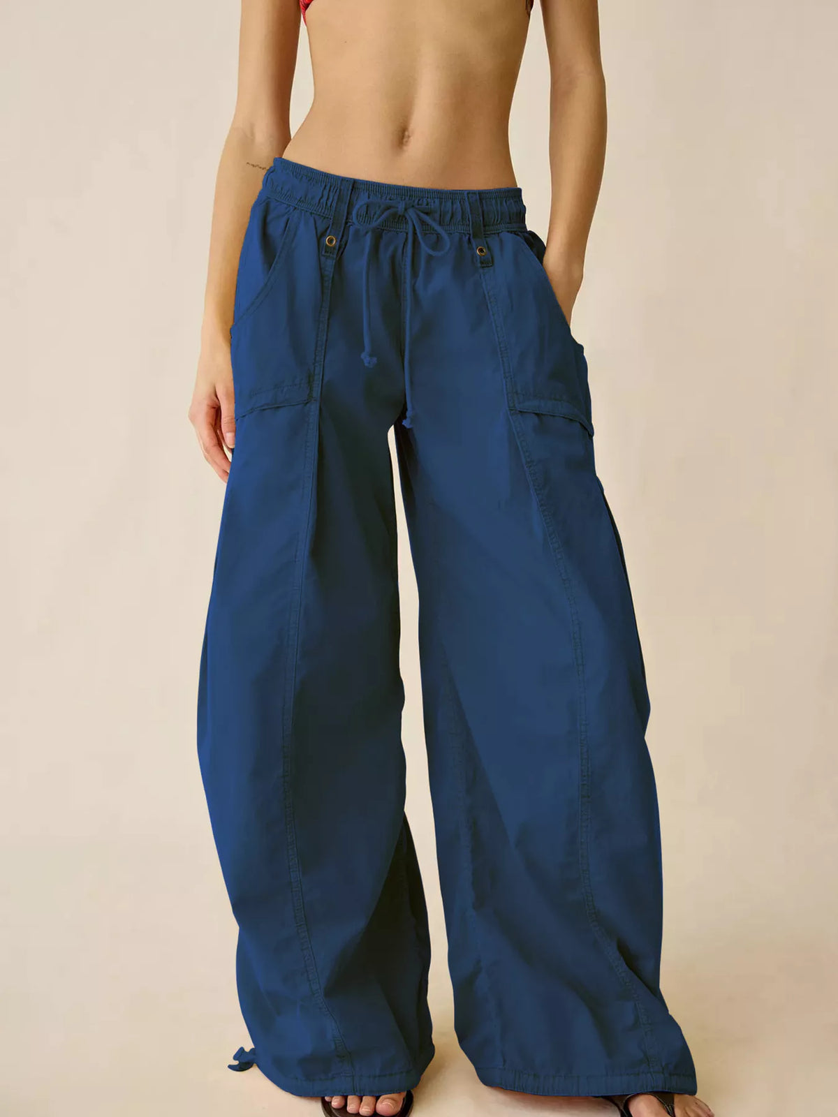 Blue high-waisted cargo wide-leg pants with drawstring waist and side cargo pockets