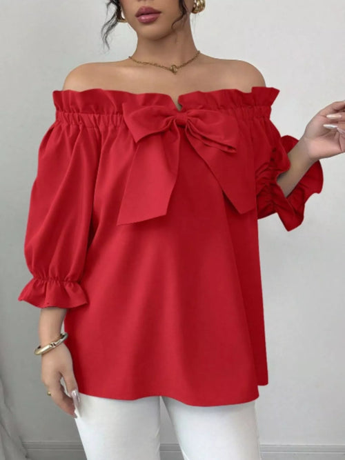 Red off-shoulder blouse with large bow at neckline and flounce-style sleeve cuffs