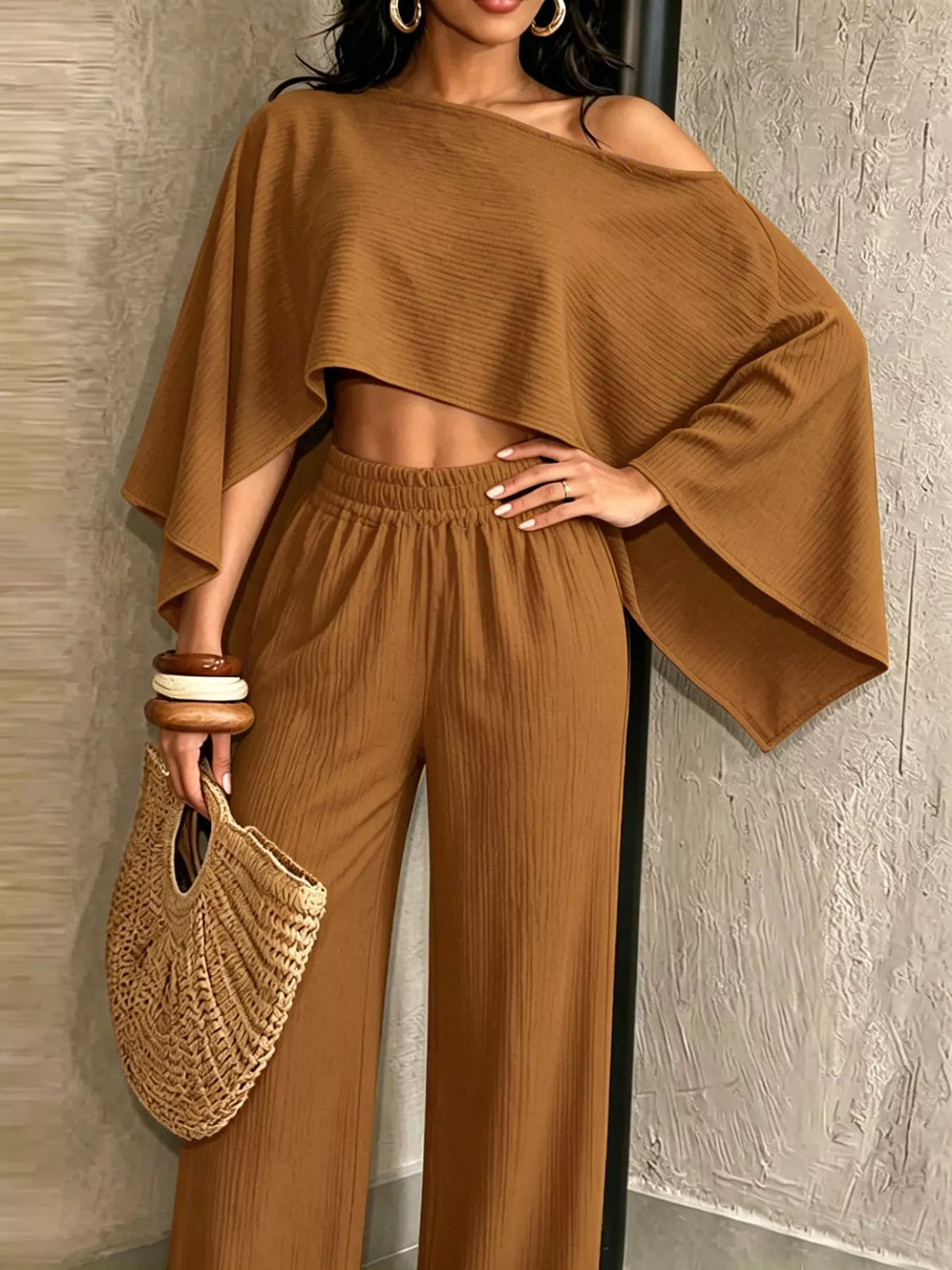 Brown boat-neck crop top with loose dolman sleeves and wide-leg pants