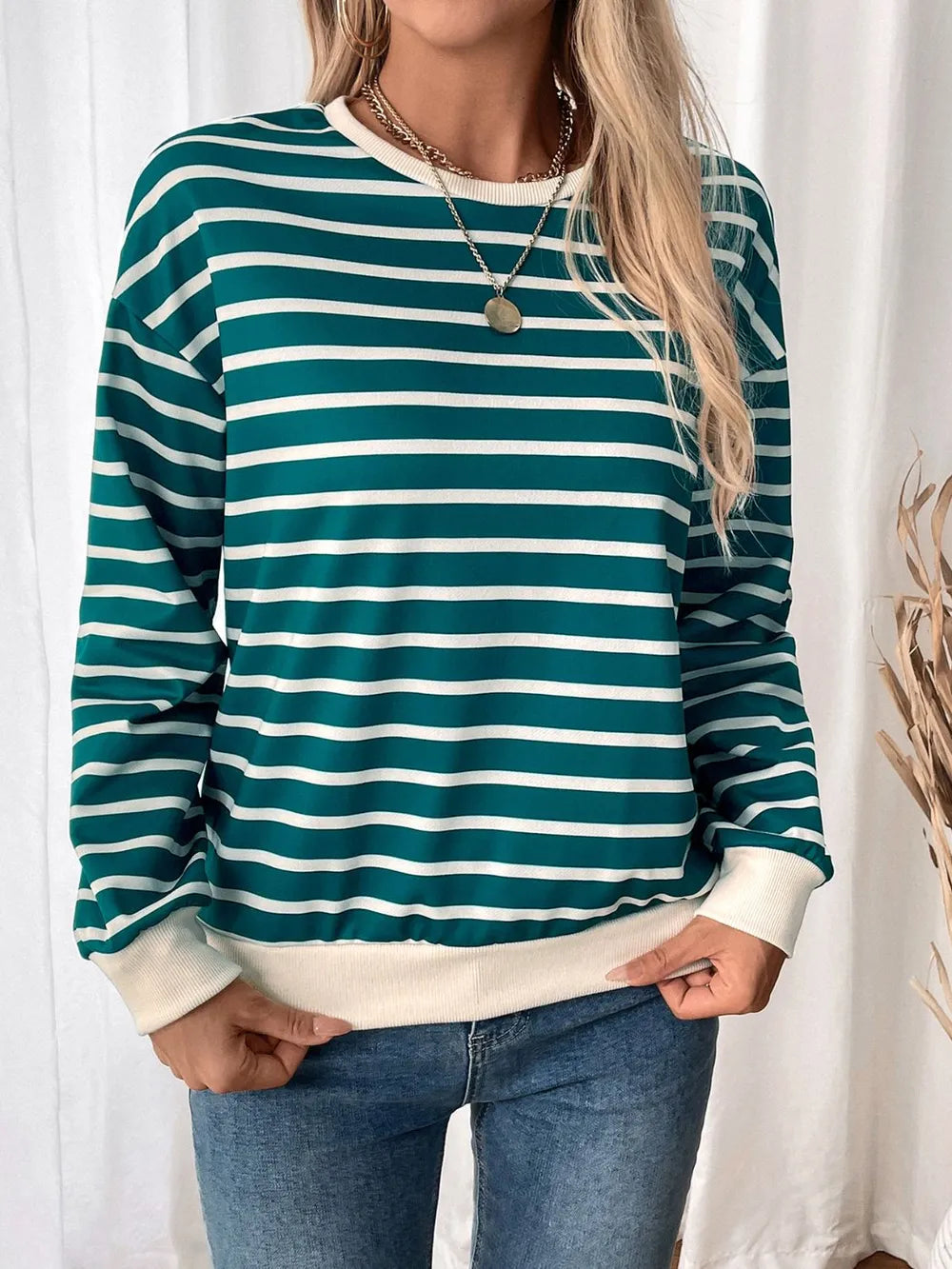 Turquoise and white striped long-sleeve sweatshirt with round neck and contrast cuffs