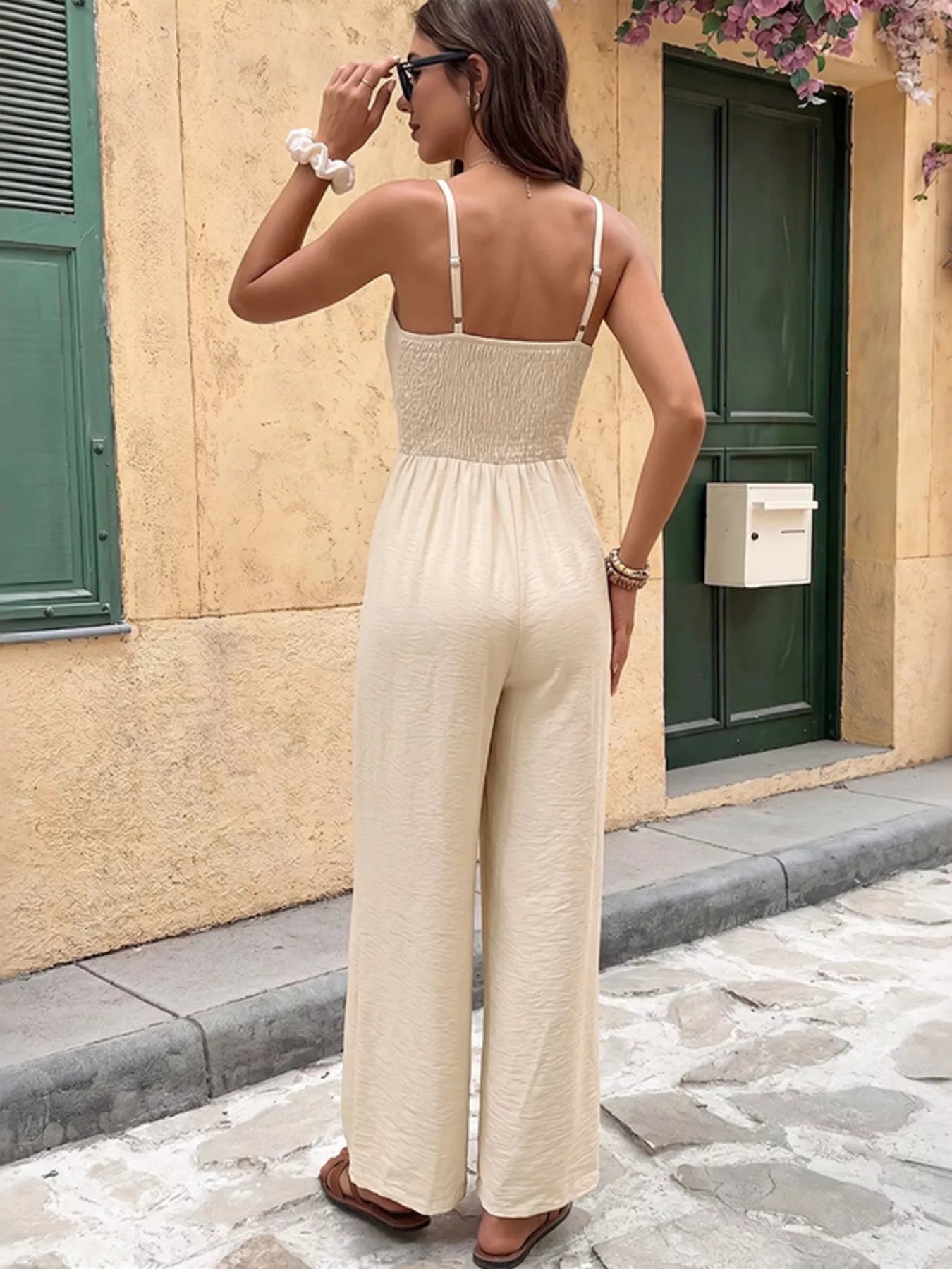 Cedar & Moore Lace Trim Spaghetti Strap Jumpsuit in cream with a smocked bodice and wide-leg pants, back view