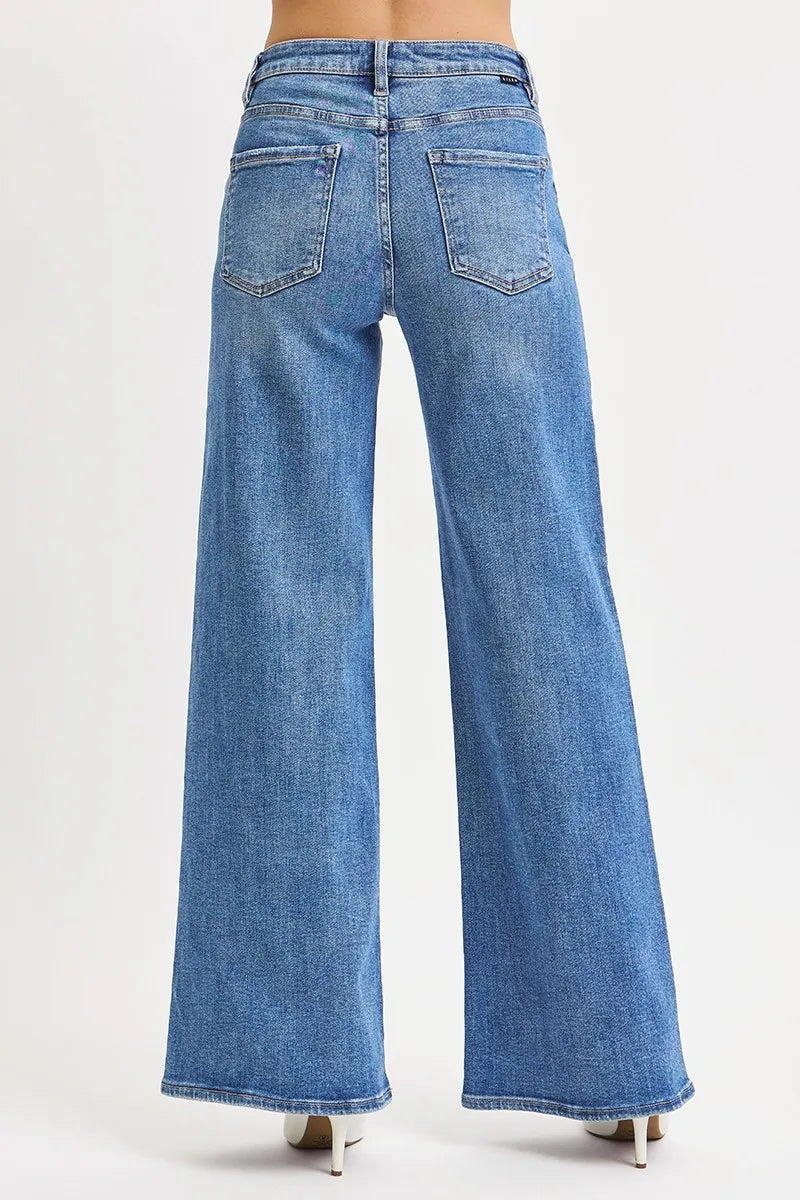 Medium wash high-rise wide-leg jeans with back yoke and patch pockets