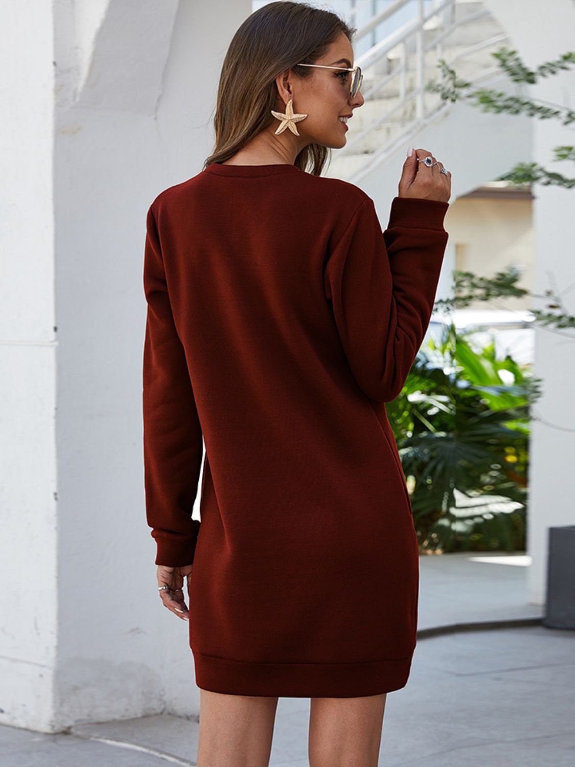 Burgundy long-sleeve mini dress with round neck, back view