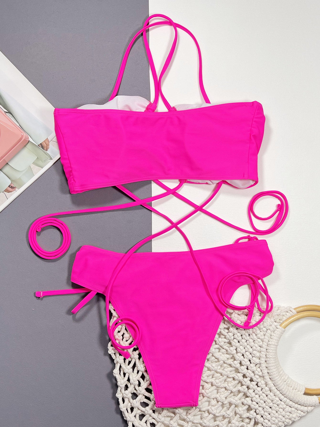 Hot pink halter bikini top with drawstring ties and ruched cups, matching bottoms