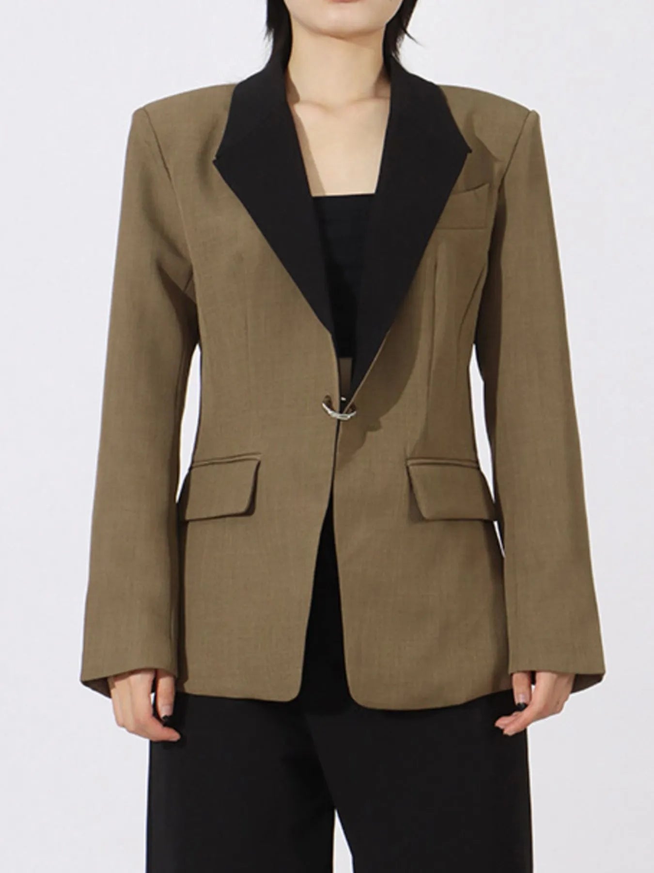 Khaki green blazer with black contrast lapels, flap pockets, and long sleeves