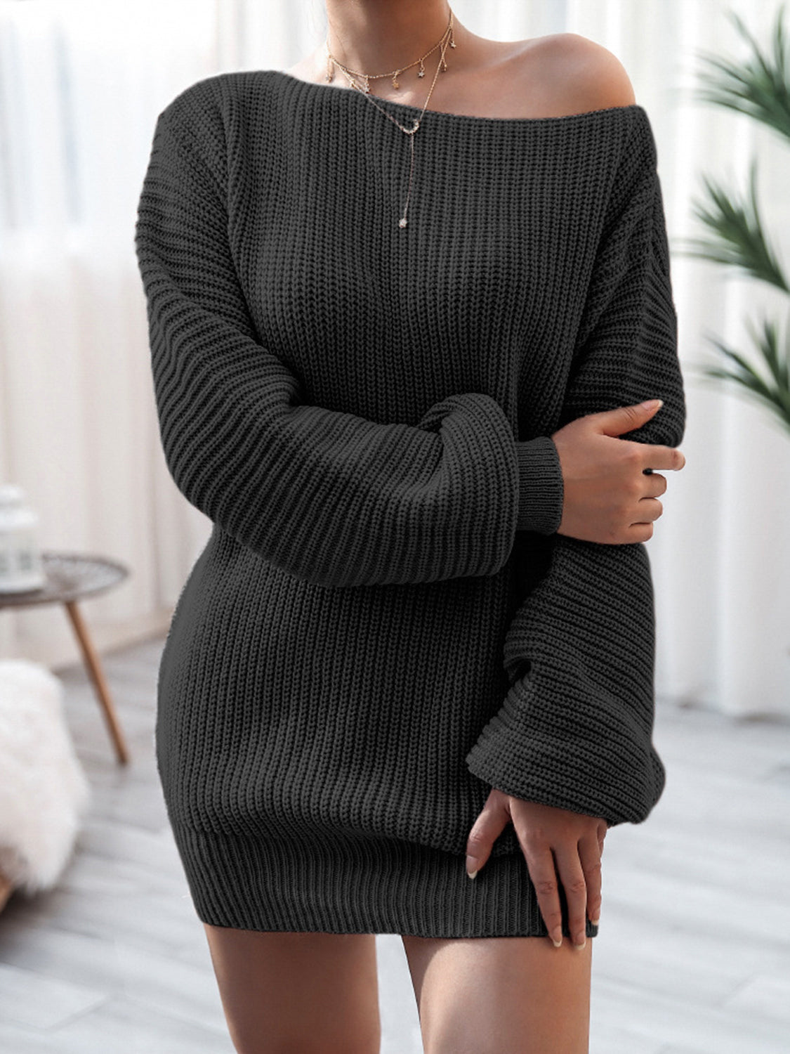 Rib-knit mini sweater dress, charcoal black, long sleeves, wide neckline.