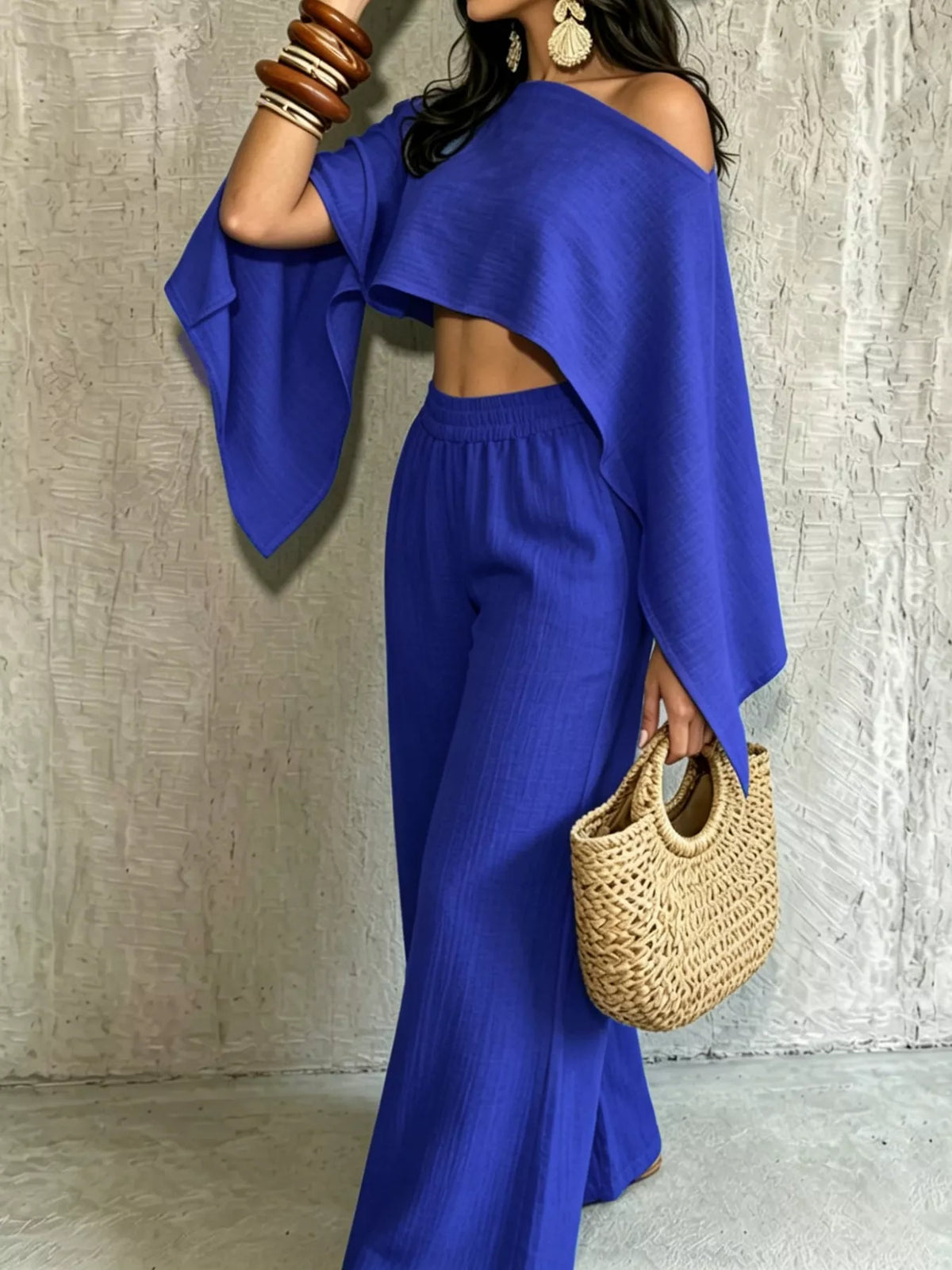 Women’s blue boat-neck crop top and wide-leg pants set, draped sleeve detail