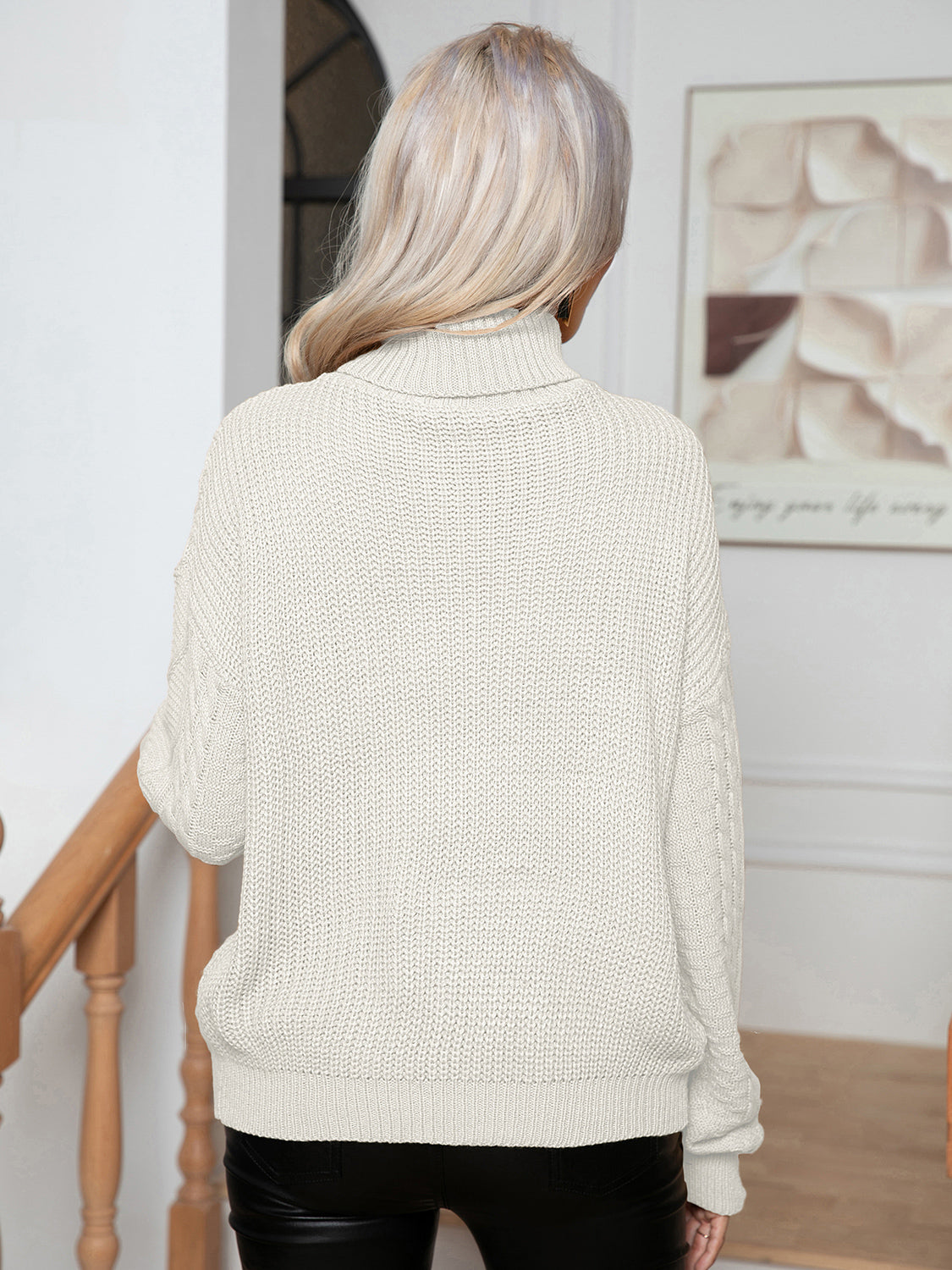 Ivory cable-knit turtleneck sweater, full back view with long sleeves