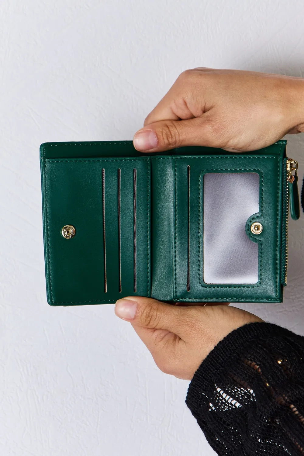 Green textured vegan leather mini wallet open interior with card slots and zipper pocket