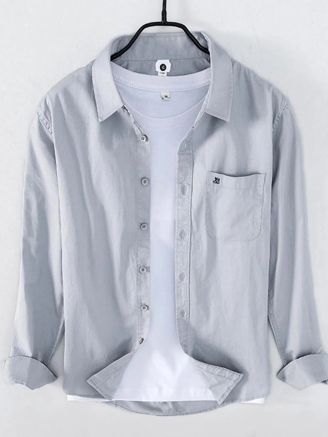 Light gray long sleeve button-up shirt with chest pocket and button placket