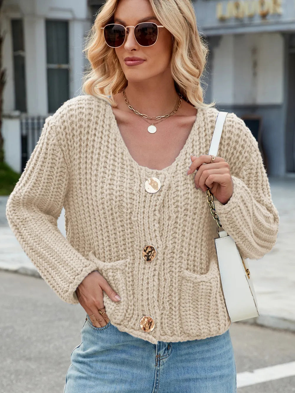 Beige round-neck button cardigan with long sleeves and front patch pockets