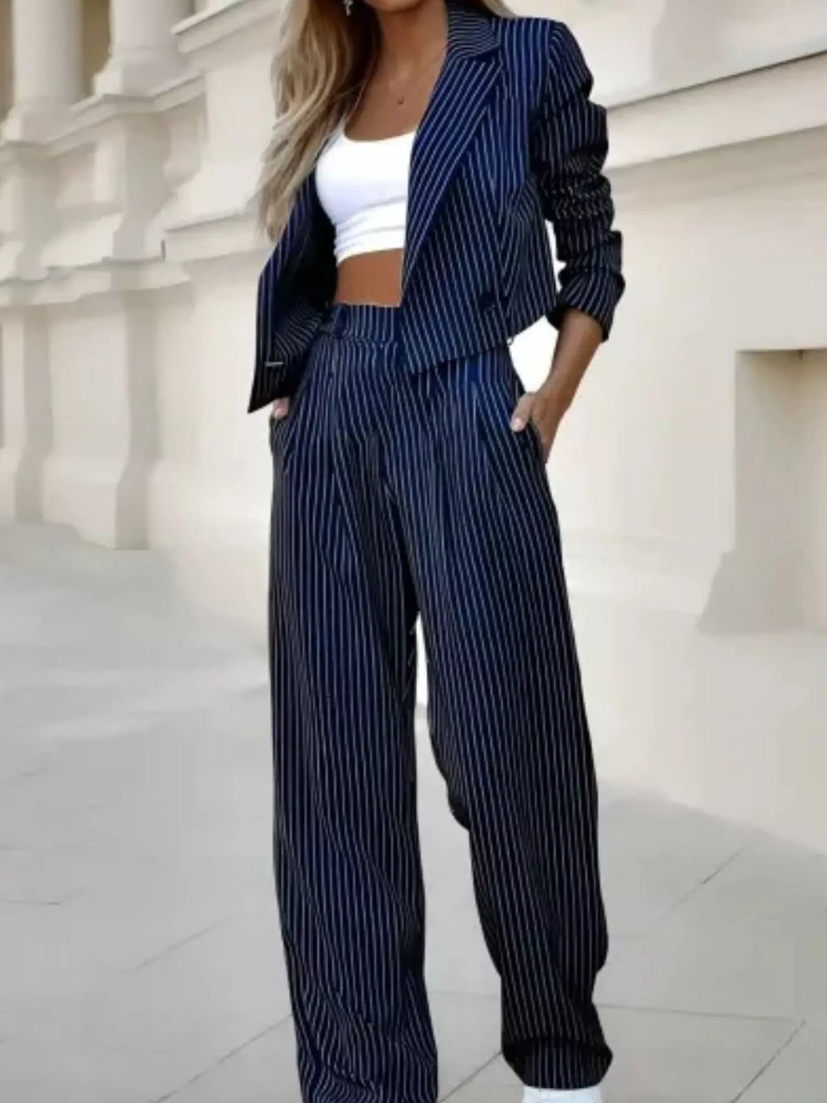 Navy pinstripe cropped blazer with matching wide-leg pants and matching belt