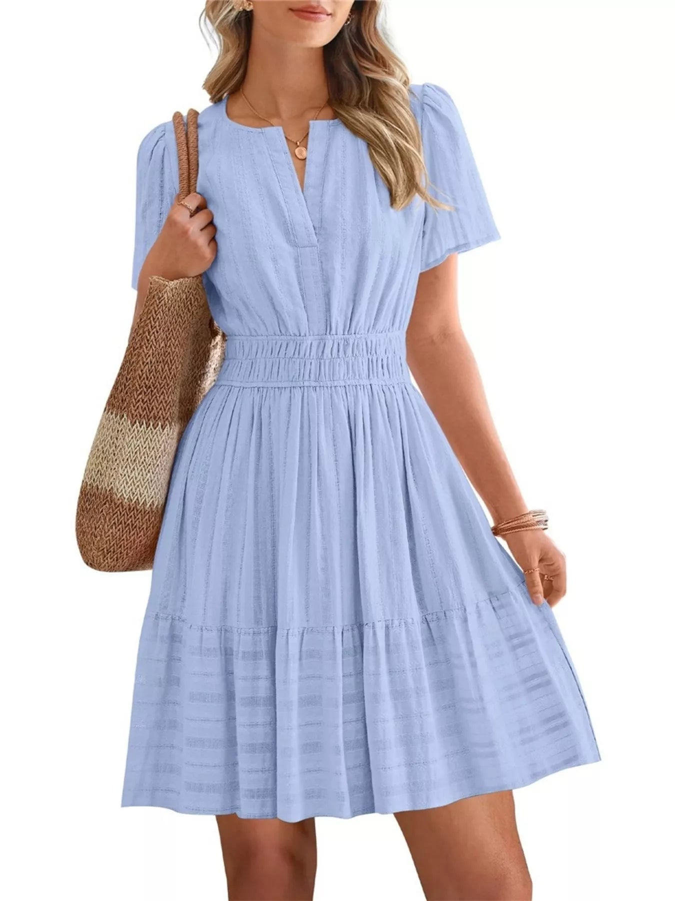 Light blue short-sleeve smocked-waist tiered dress with V-neck and ruffle tiers.
