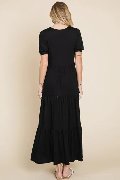 Black short-sleeve tiered maxi dress from back view