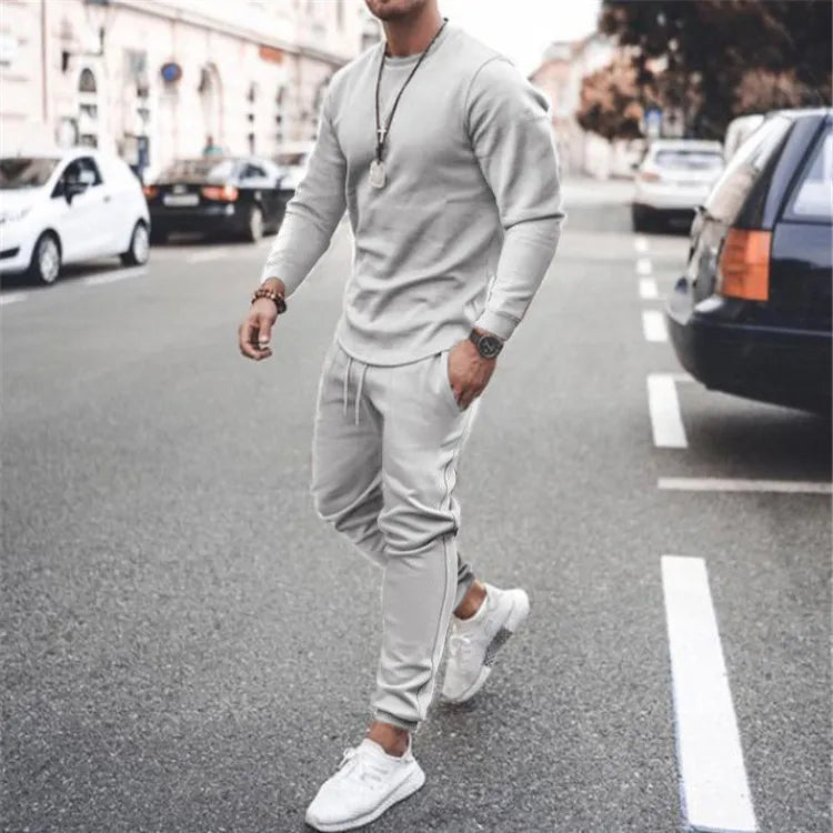 Men's light gray long sleeve lounge set with crewneck top and cuffed jogger pants