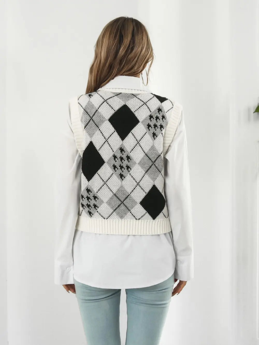 Back view V-neck plaid sweater vest with black and white diamond argyle pattern, sleeveless knit