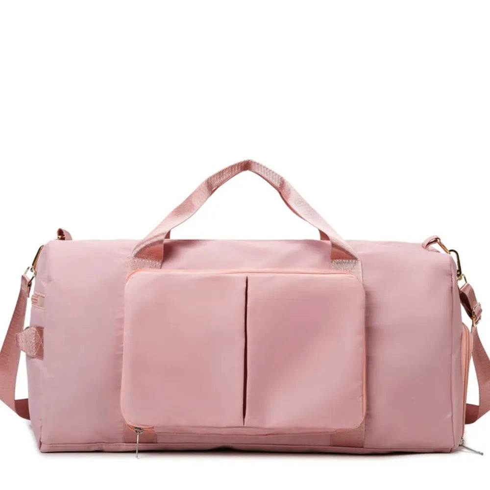 Large travel duffel bag with front zip pocket, pale pink body and top carry handles