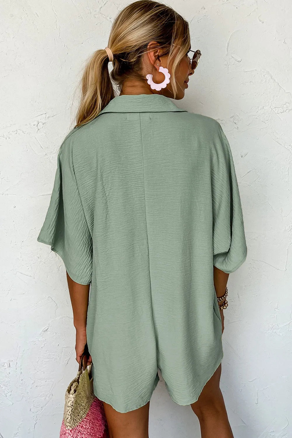 Sage collared romper back view with short sleeves and relaxed fit