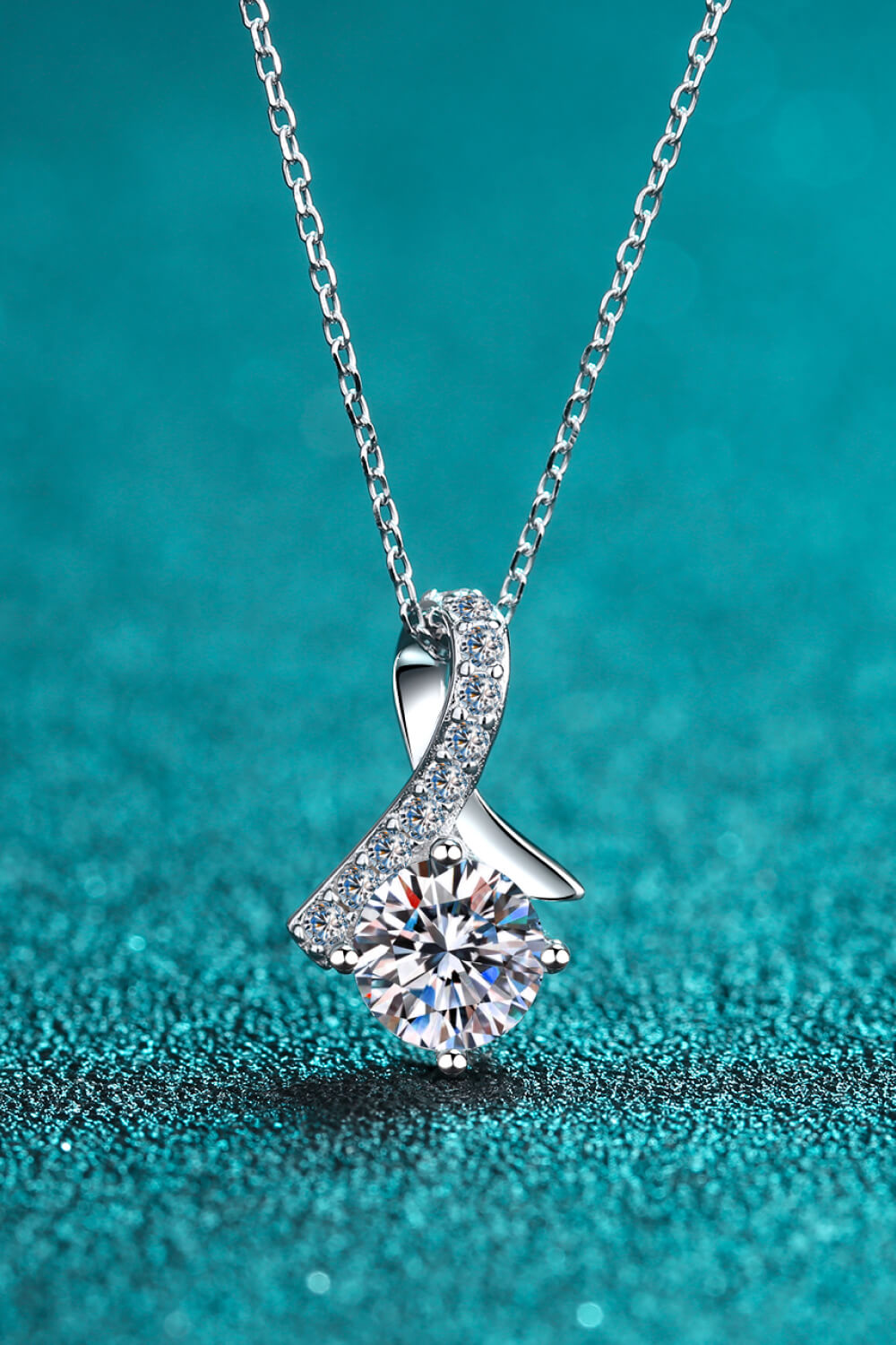 Silver moissanite pendant necklace with heart-shaped prong-set stone cluster pendant