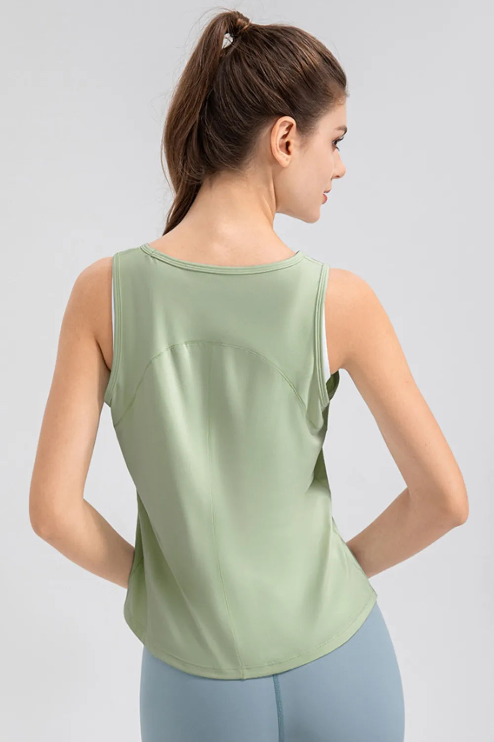 Women’s light green active tank top, back view with wide straps
