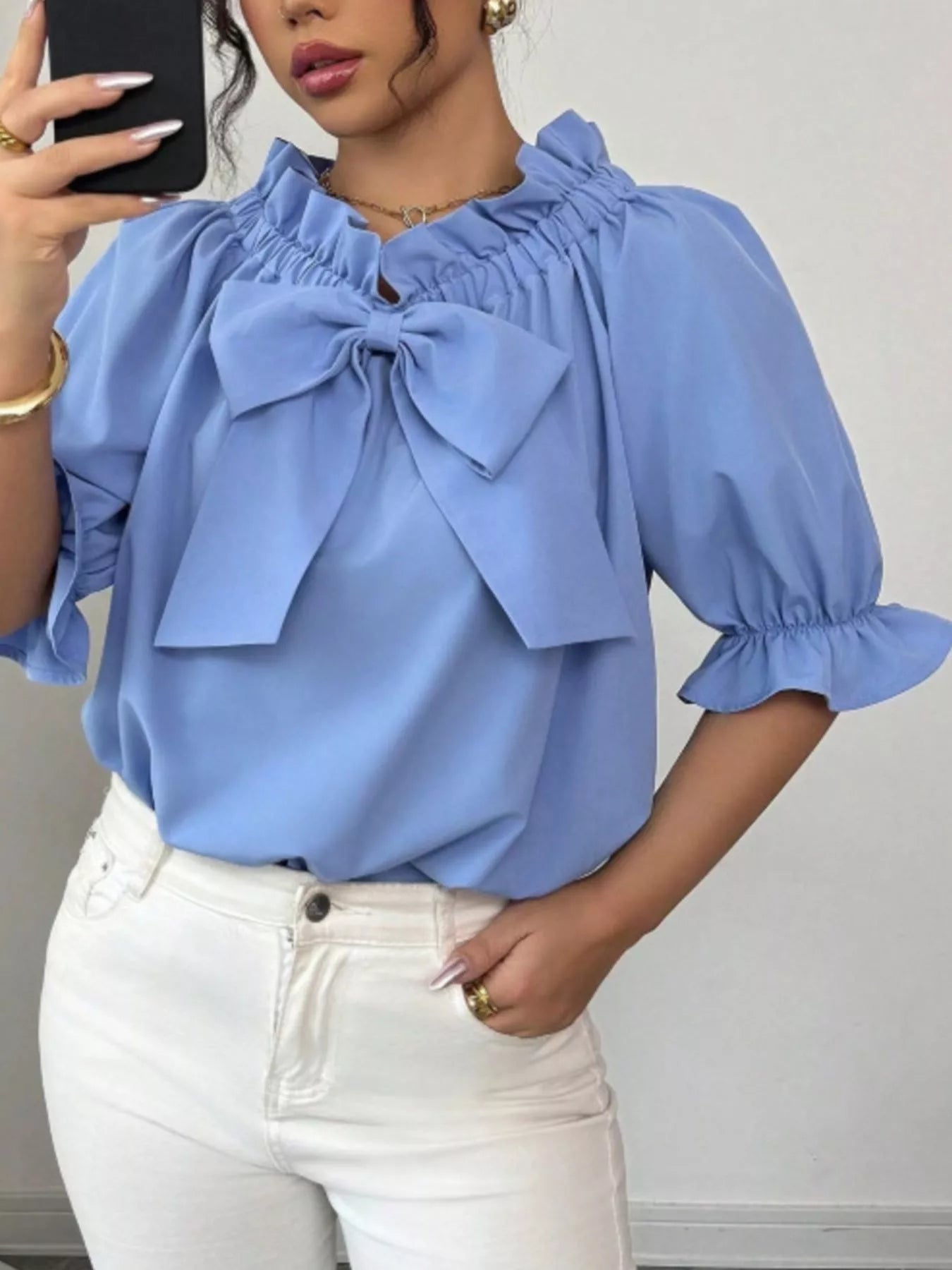 Bow Flounce Sleeve Blouse by Trendsi in light blue with a large front bow and ruffled neckline.