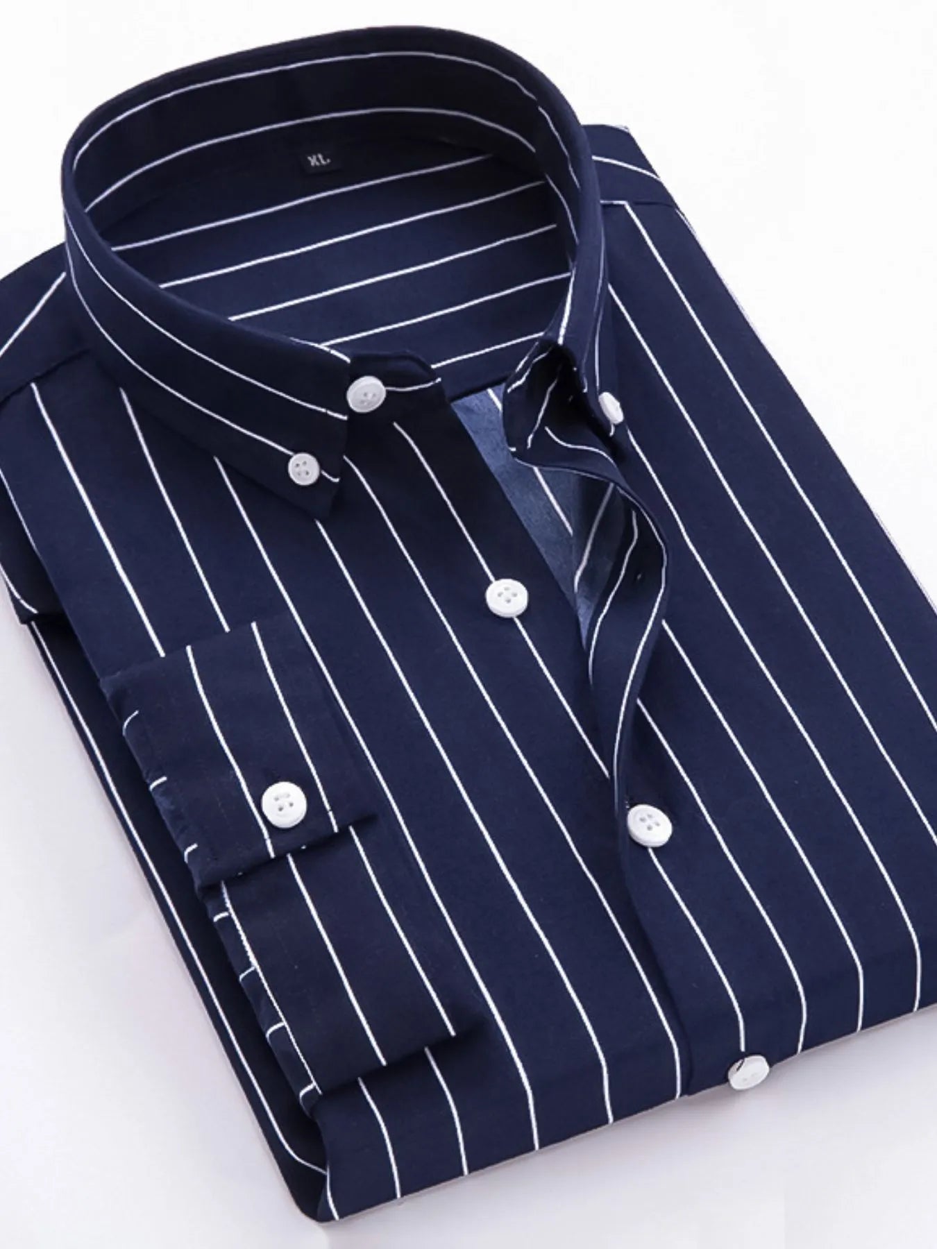Striped button-up long-sleeve shirt in navy and white with round white buttons