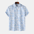 Light blue printed short-sleeve button-up shirt with pointed collar and front buttons