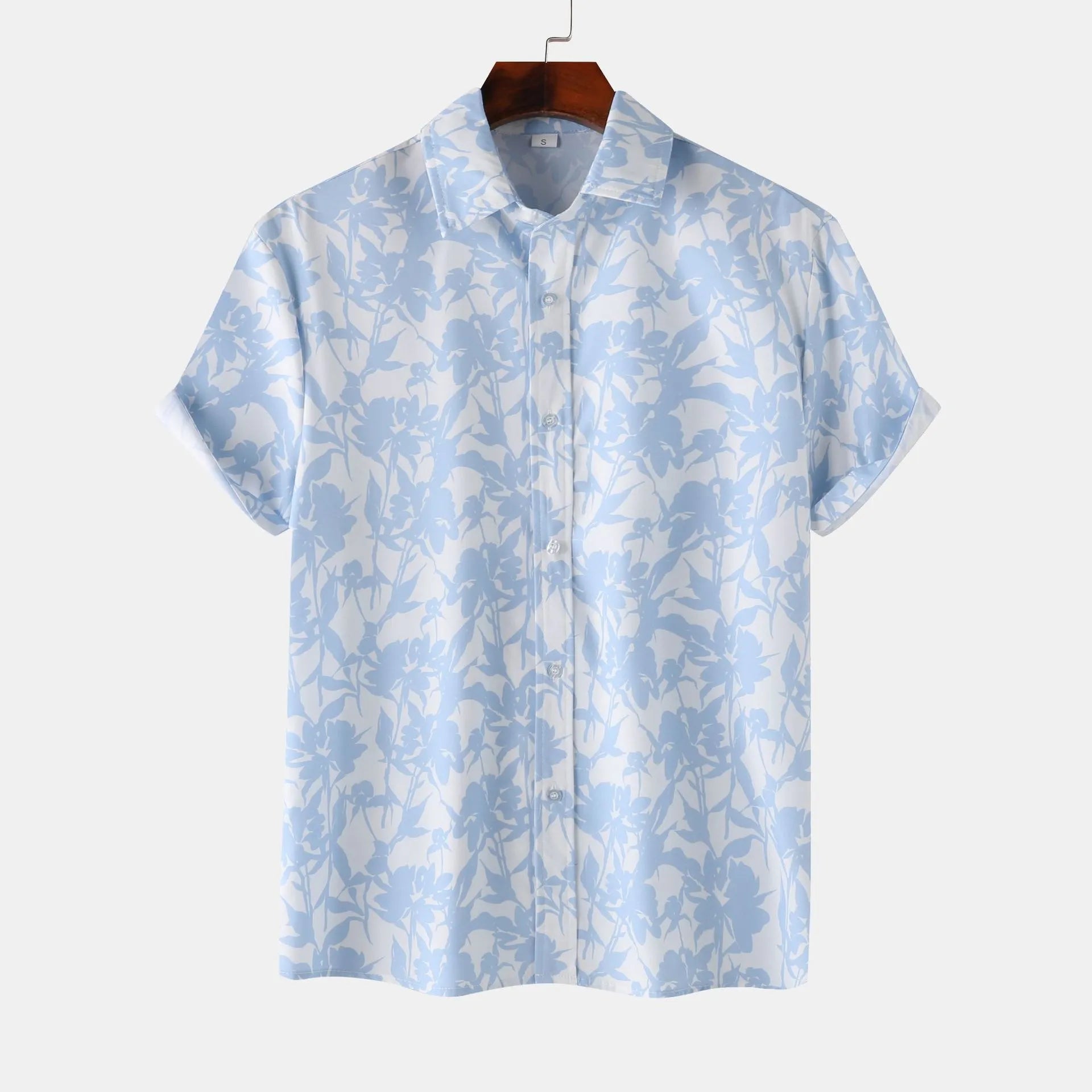 Light blue printed short-sleeve button-up shirt with pointed collar and front buttons