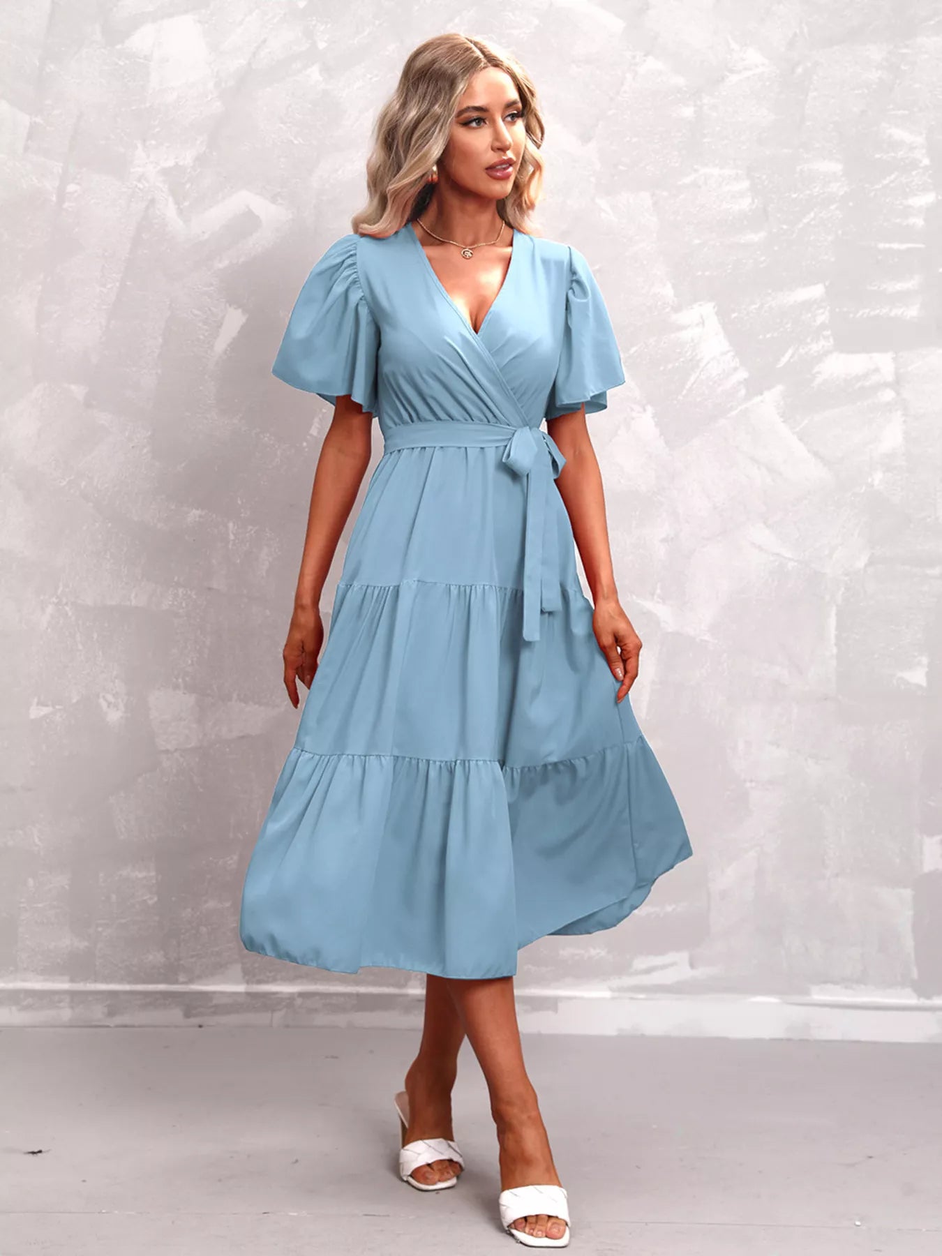 Flutter-sleeve tiered midi dress with V-neck and tied waist, light blue