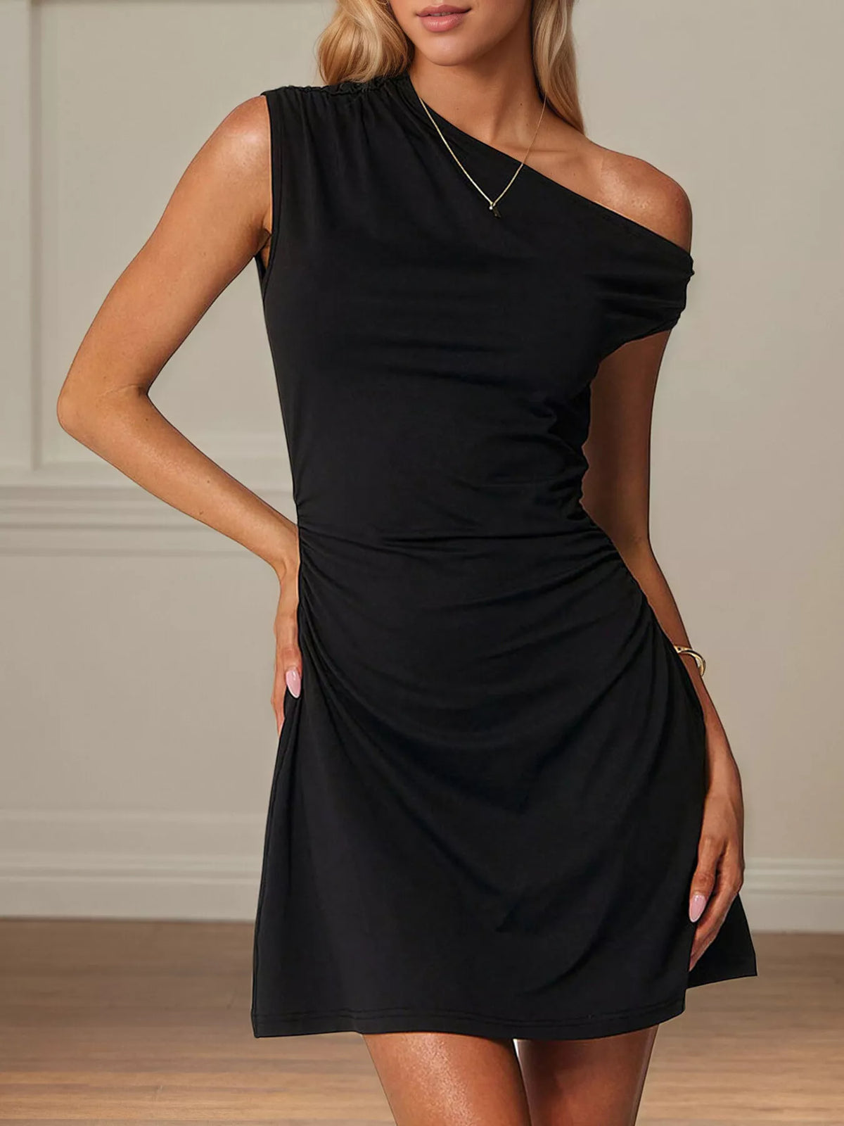 Black one-shoulder ruched bodycon mini dress with asymmetrical neckline and gathered waist
