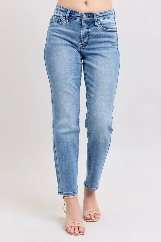 Light blue mid-rise slim jeans with vintage wash and ankle-length cropped legs