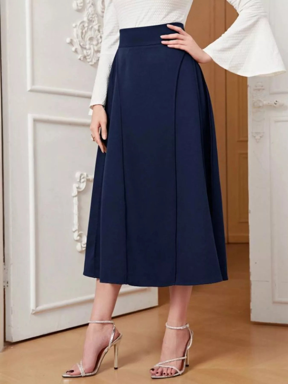Dark blue A-line midi skirt with flared hem