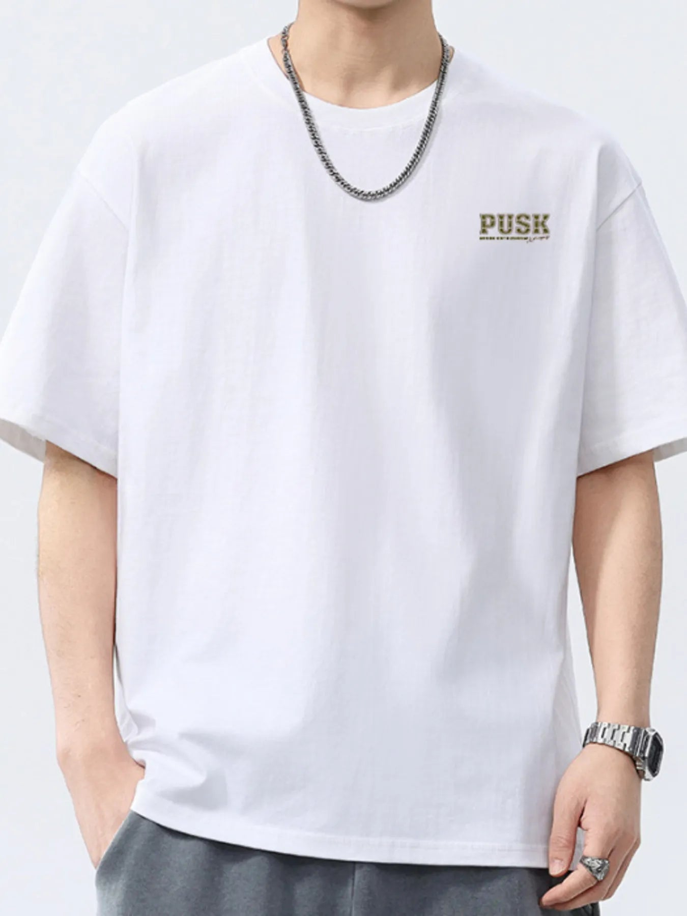 White men's short-sleeve crewneck T-shirt with small chest logo.