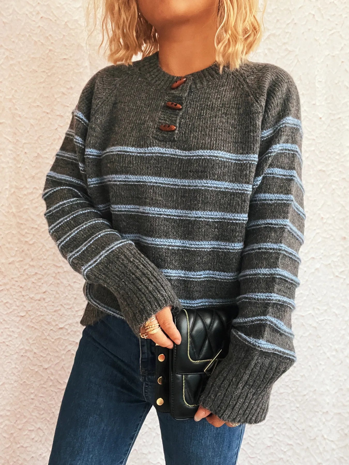 Dark gray striped long sleeve sweater with front button placket and ribbed cuffs