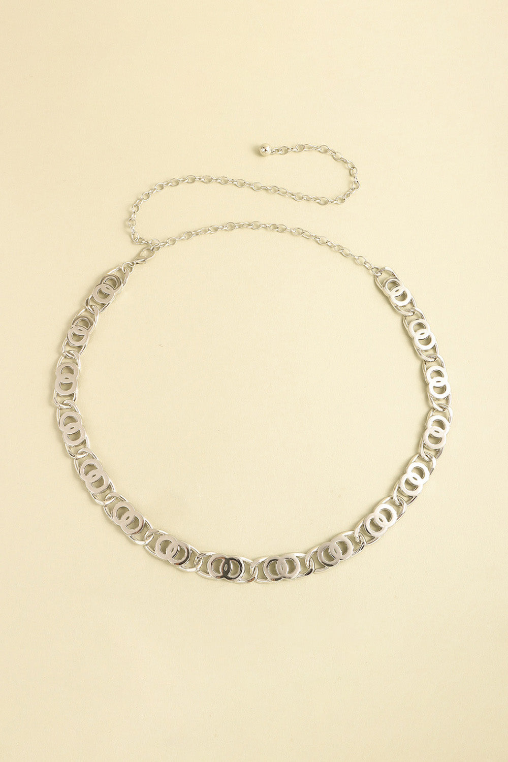Silver lobster clasp belt with oval-link chain and decorative curved link border