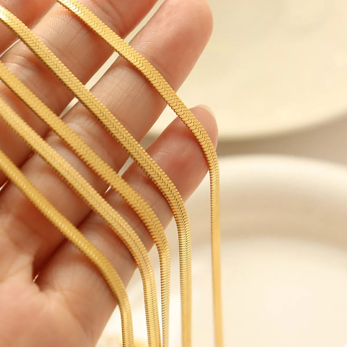 Gold-plated chain links in tight woven texture